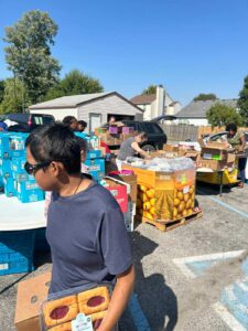 people getting food in food drive
